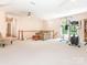 Large bonus room with neutral carpet and exercise equipment at 5417 Bedfordshire Ave, Harrisburg, NC 28075