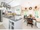 Eat-in kitchen with a breakfast nook, surrounded by bright windows at 5417 Bedfordshire Ave, Harrisburg, NC 28075