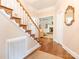 Welcoming foyer with hardwood floors and a staircase, complemented by elegant decorative details at 5417 Bedfordshire Ave, Harrisburg, NC 28075