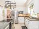 Bright kitchen featuring stainless steel appliances, granite countertops, and white cabinetry at 5417 Bedfordshire Ave, Harrisburg, NC 28075