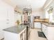 Spacious kitchen features granite countertops, stainless steel appliances, and a pot rack at 5417 Bedfordshire Ave, Harrisburg, NC 28075