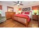 Comfortable main bedroom with a queen-sized bed, wood floors, and ample natural light at 5417 Bedfordshire Ave, Harrisburg, NC 28075