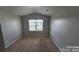 Neutral bedroom featuring wall to wall carpeting and a bright window for natural light at 5823 Natick Dr, Charlotte, NC 28214