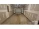 Spacious garage with a functional layout and ample lighting at 5823 Natick Dr, Charlotte, NC 28214