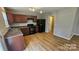 Bright kitchen with updated appliances and wood-look flooring at 5823 Natick Dr, Charlotte, NC 28214