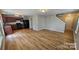 Spacious living room featuring wood flooring and an open layout at 5823 Natick Dr, Charlotte, NC 28214