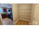 Pantry space with practical shelving for optimal storage at 5823 Natick Dr, Charlotte, NC 28214
