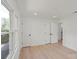 Spacious bedroom with light wood floors, bright natural light, and direct access to ensuite bathroom at 5910 Grosner Pl, Charlotte, NC 28211