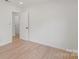 Neutral bedroom showcases hardwood floors and is ready for personalization at 5910 Grosner Pl, Charlotte, NC 28211