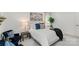 Well-lit bedroom featuring neutral decor, plush carpet, and coordinated furnishings for a serene retreat at 5910 Grosner Pl, Charlotte, NC 28211
