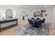 Bright dining area with modern furnishings and decor, and an open view to kitchen at 5910 Grosner Pl, Charlotte, NC 28211