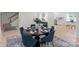 Bright dining area with modern furnishings and decor, and an open view to entryway and kitchen at 5910 Grosner Pl, Charlotte, NC 28211