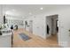 Full open kitchen featuring stainless steel appliances, marble countertops, and a large kitchen island at 5910 Grosner Pl, Charlotte, NC 28211
