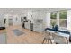 Open kitchen with white cabinets, marble countertops, and stainless steel appliances at 5910 Grosner Pl, Charlotte, NC 28211