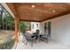 A covered outdoor patio offers a cozy space for entertaining guests at 5910 Grosner Pl, Charlotte, NC 28211