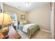 Comfortable bedroom with carpet flooring, a window with blinds, and a cozy bed at 611 Tee Ridge Ct, Fort Mill, SC 29715