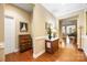 Elegant hallway with hardwood floors, decorative molding, and transitional furnishings at 611 Tee Ridge Ct, Fort Mill, SC 29715