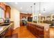 Gourmet kitchen with granite countertops, stainless steel appliances, and a large island with seating at 611 Tee Ridge Ct, Fort Mill, SC 29715