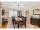 Bright dining room with hardwood floors, lots of natural light, and an elegant chandelier at 625 N Center St # 4, Statesville, NC 28677