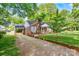 Charming brick home with a driveway, carport, shutters, and manicured landscaping at 625 N Center St # 4, Statesville, NC 28677