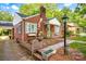 Charming brick home with shutters, flower boxes and a quaint front porch entrance, plus a vintage lamppost at 625 N Center St # 4, Statesville, NC 28677