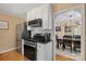 Kitchen featuring stainless steel appliances, white cabinets, and an open view to the dining room at 625 N Center St # 4, Statesville, NC 28677