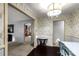 Charming dining area with decorative wallpaper, elegant lighting, and wood floors at 709 Plantation Rd, Lancaster, SC 29720