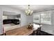 Dining area showcasing a wooden table, chandelier lighting and hardwood floors at 709 Plantation Rd, Lancaster, SC 29720