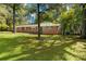 Charming brick ranch-style home with large front yard and mature trees providing ample shade at 709 Plantation Rd, Lancaster, SC 29720