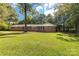 Lovely brick ranch home featuring a large front lawn and lush greenery all around at 709 Plantation Rd, Lancaster, SC 29720