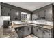 Updated kitchen featuring sleek gray cabinets and modern appliances, plus ample counter space at 709 Plantation Rd, Lancaster, SC 29720