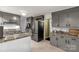 Spacious kitchen features grey cabinetry and modern stainless steel appliances at 709 Plantation Rd, Lancaster, SC 29720