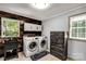 Functional laundry room features a rustic accent wall and modern appliances at 709 Plantation Rd, Lancaster, SC 29720
