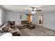 Spacious living room with a ceiling fan and a sliding barn door at 709 Plantation Rd, Lancaster, SC 29720