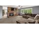 Cozy living room features a brick fireplace and multiple windows at 709 Plantation Rd, Lancaster, SC 29720