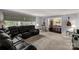 Spacious living room featuring a plush leather sectional sofa and large windows at 709 Plantation Rd, Lancaster, SC 29720