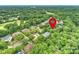 An aerial view shows a well-developed residential area, highlighting lush, mature trees and landscaping at 7812 Seton House Ln, Charlotte, NC 28277
