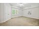 Bedroom with carpet and window, with an adjacent closet at 7812 Seton House Ln, Charlotte, NC 28277