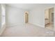 Neutral bedroom with carpet, baseboard and window with window shutters at 7812 Seton House Ln, Charlotte, NC 28277