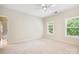 Neutral bedroom with carpet, 2 windows with window shutters and white trim at 7812 Seton House Ln, Charlotte, NC 28277