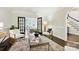 Stylish living room showcasing hardwood floors, elegant furnishings, and a view through French doors at 7812 Seton House Ln, Charlotte, NC 28277