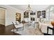 Comfortable living room with a fireplace, custom shelving, and a view to another room at 7812 Seton House Ln, Charlotte, NC 28277