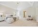 Spacious main bedroom featuring tray ceilings, neutral color palette, and ample natural light at 7812 Seton House Ln, Charlotte, NC 28277