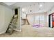 Spacious recreation room featuring custom-built ladders to elevated spaces and a suspended indoor swing with yoga mats at 7812 Seton House Ln, Charlotte, NC 28277