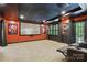 Movie theater room with star-lit ceiling, projector screen, sconce lighting and reclining chairs at 7812 Seton House Ln, Charlotte, NC 28277