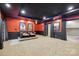 Home theater featuring tiered seating, movie poster decor, projector, and access to entertainment spaces at 7812 Seton House Ln, Charlotte, NC 28277