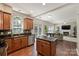 Bright kitchen with stainless steel appliances and a large island with granite countertops at 7833 Taymouth Ln, Charlotte, NC 28269