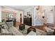 Open-concept view of living room and dining area, with hardwood floors and neutral decor at 7833 Taymouth Ln, Charlotte, NC 28269
