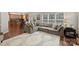 Open floor plan with a large couch, hardwood floors, and lots of natural light at 7833 Taymouth Ln, Charlotte, NC 28269