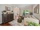 Bright living room with hardwood floors, neutral furniture, and large windows at 7833 Taymouth Ln, Charlotte, NC 28269